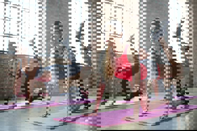 a woman in a red tank top with the word columbia on it